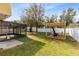 Landscaped backyard with pergola and screened porch at 1624 Valmont Ln, Apopka, FL 32703