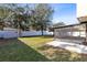 Spacious backyard with screened patio, shed, and fenced perimeter at 1624 Valmont Ln, Apopka, FL 32703