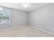 Neutral bedroom with carpeted floor and window providing natural light at 1624 Valmont Ln, Apopka, FL 32703
