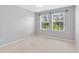 Bright bedroom with two windows and neutral decor at 1624 Valmont Ln, Apopka, FL 32703