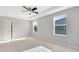 Spacious bedroom with tray ceiling, carpeted floor, and natural light at 1624 Valmont Ln, Apopka, FL 32703
