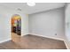 Empty dining room with hardwood floors and an archway to the kitchen at 1624 Valmont Ln, Apopka, FL 32703