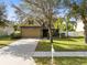 Two story house with landscaped lawn and attached garage at 1624 Valmont Ln, Apopka, FL 32703