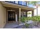 Inviting front porch with stone accents and landscaping at 1624 Valmont Ln, Apopka, FL 32703