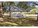 White gazebo with a picnic table in a grassy area at 1624 Valmont Ln, Apopka, FL 32703