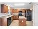 Modern kitchen with stainless steel appliances and an island at 1624 Valmont Ln, Apopka, FL 32703