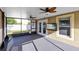 Screened porch with ceiling fans and backyard views at 1624 Valmont Ln, Apopka, FL 32703