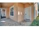 Front entrance of townhome with tiled walkway and white door at 1711 Retreat Cir, Clermont, FL 34714