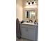 Bathroom vanity with granite countertop and gray cabinets at 215 Church S St, Haines City, FL 33844