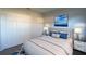 Bedroom with a queen-size bed and double door closet at 217 Bentbough Dr, Leesburg, FL 34748