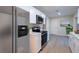 Modern kitchen with white shaker cabinets and quartz countertops at 217 Bentbough Dr, Leesburg, FL 34748