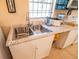 Kitchen with double sink and granite countertops at 2212 Orange Center Blvd, Orlando, FL 32805