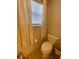 Small bathroom with toilet and window at 2530 Saffron Ln, The Villages, FL 32162