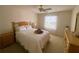 Comfortable bedroom with a queen-size bed and dresser at 2530 Saffron Ln, The Villages, FL 32162