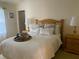 Bright bedroom with a queen-size bed and wooden nightstands at 2530 Saffron Ln, The Villages, FL 32162