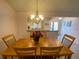 Bright dining room with kitchen and entry views at 2530 Saffron Ln, The Villages, FL 32162