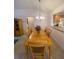 Dining room with a chandelier and seating for six at 2530 Saffron Ln, The Villages, FL 32162