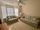 Cozy guest room featuring two sofas and large windows at 2530 Saffron Ln, The Villages, FL 32162