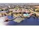 Aerial view of community clubhouse and lake at 255 Vista Oaks Way, Davenport, FL 33837