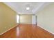 Bright main bedroom with hardwood floors and ceiling fan at 255 Vista Oaks Way, Davenport, FL 33837