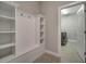 Laundry room with built-in shelving and washer/dryer at 2724 Matera Dr, Saint Cloud, FL 34771