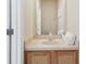 Small half bathroom with single sink and wood vanity at 2740 Coupe St, Kissimmee, FL 34746