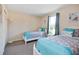 Bedroom with two twin beds, window, and ample closet space at 2740 Coupe St, Kissimmee, FL 34746