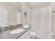 Clean bathroom with a tub shower, modern vanity, and updated fixtures at 2748 Bookmark Dr, Kissimmee, FL 34746
