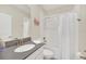 Clean bathroom with a tub shower, modern vanity, and updated fixtures at 2748 Bookmark Dr, Kissimmee, FL 34746