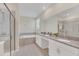 Bathroom boasts double vanity, soaking tub, and shower at 2748 Bookmark Dr, Kissimmee, FL 34746