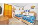 Minions themed bedroom with twin beds and fun wall art at 2748 Bookmark Dr, Kissimmee, FL 34746