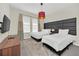Bedroom with two twin beds and modern decor at 2748 Bookmark Dr, Kissimmee, FL 34746