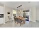 Bright dining room featuring a wood table and six gray chairs at 2748 Bookmark Dr, Kissimmee, FL 34746