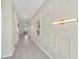 Bright hallway with tile flooring, recessed lighting and decorative wall at 2748 Bookmark Dr, Kissimmee, FL 34746