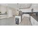 Modern kitchen with white cabinets, large island, and stainless steel appliances at 2748 Bookmark Dr, Kissimmee, FL 34746
