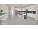 Modern kitchen with white cabinets, large island, and stainless steel appliances at 2748 Bookmark Dr, Kissimmee, FL 34746