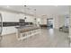 Modern kitchen with white cabinets, a large island, and stainless steel appliances at 2748 Bookmark Dr, Kissimmee, FL 34746