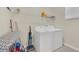 Functional laundry room with washer, dryer, and storage at 2748 Bookmark Dr, Kissimmee, FL 34746