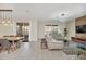 Open living space with light-colored furniture and a stylish rug at 2748 Bookmark Dr, Kissimmee, FL 34746