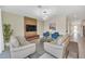 Open concept living room with a view of kitchen and dining area at 2748 Bookmark Dr, Kissimmee, FL 34746