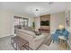 Spacious living room, featuring a wood accent wall and a large TV at 2748 Bookmark Dr, Kissimmee, FL 34746