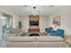 Living room with light beige sofa and blue accent chairs at 2748 Bookmark Dr, Kissimmee, FL 34746