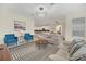 Elegant living room with a view into kitchen and dining area at 2748 Bookmark Dr, Kissimmee, FL 34746