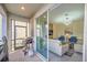 Patio with gas grill, adjacent to a living area at 2748 Bookmark Dr, Kissimmee, FL 34746