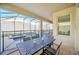 Covered patio with table and chairs, overlooking the pool at 2748 Bookmark Dr, Kissimmee, FL 34746