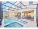 Relaxing screened pool and spa with patio furniture at 2748 Bookmark Dr, Kissimmee, FL 34746