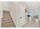 Carpeted staircase with neutral tones, leading to the upper level at 2748 Bookmark Dr, Kissimmee, FL 34746