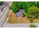 Aerial view of the home with lush, mature trees at 2803 E Pine St, Orlando, FL 32803