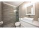 Clean bathroom with a single vanity, toilet, and a walk-in shower at 2803 E Pine St, Orlando, FL 32803