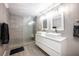 Updated bathroom with a walk-in shower, double vanity, and modern tile at 2803 E Pine St, Orlando, FL 32803